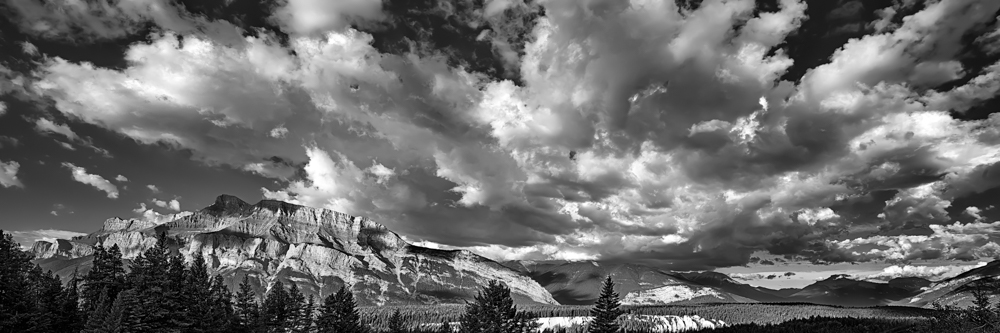Huge clouds glide over the Bow Valley, the Town of Banff and Mt. Rundle